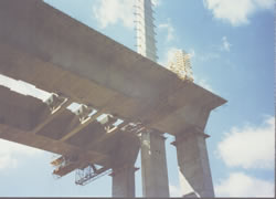 Custom Cantilever Work Platforms for Finishing Concrete & Installation of Delta Frames on Precast Segmental Box Girder Bridges