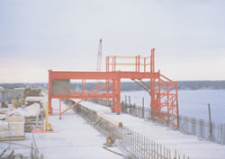 Custom Cantilever Work Platforms for Finishing Concrete & Installation of Delta Frames on Precast Segmental Box Girder Bridges