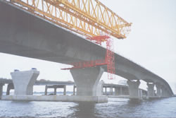 Custom Cantilever Work Platforms for Finishing Concrete & Installation of Delta Frames on Precast Segmental Box Girder Bridges